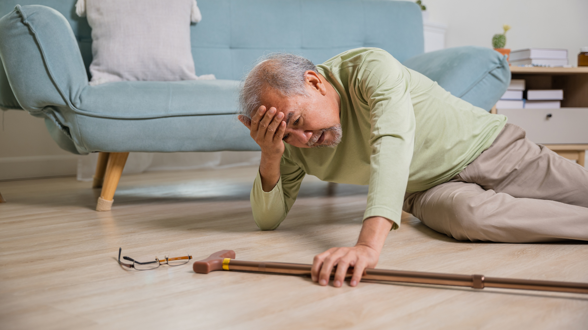 older man has fallen onto the floor