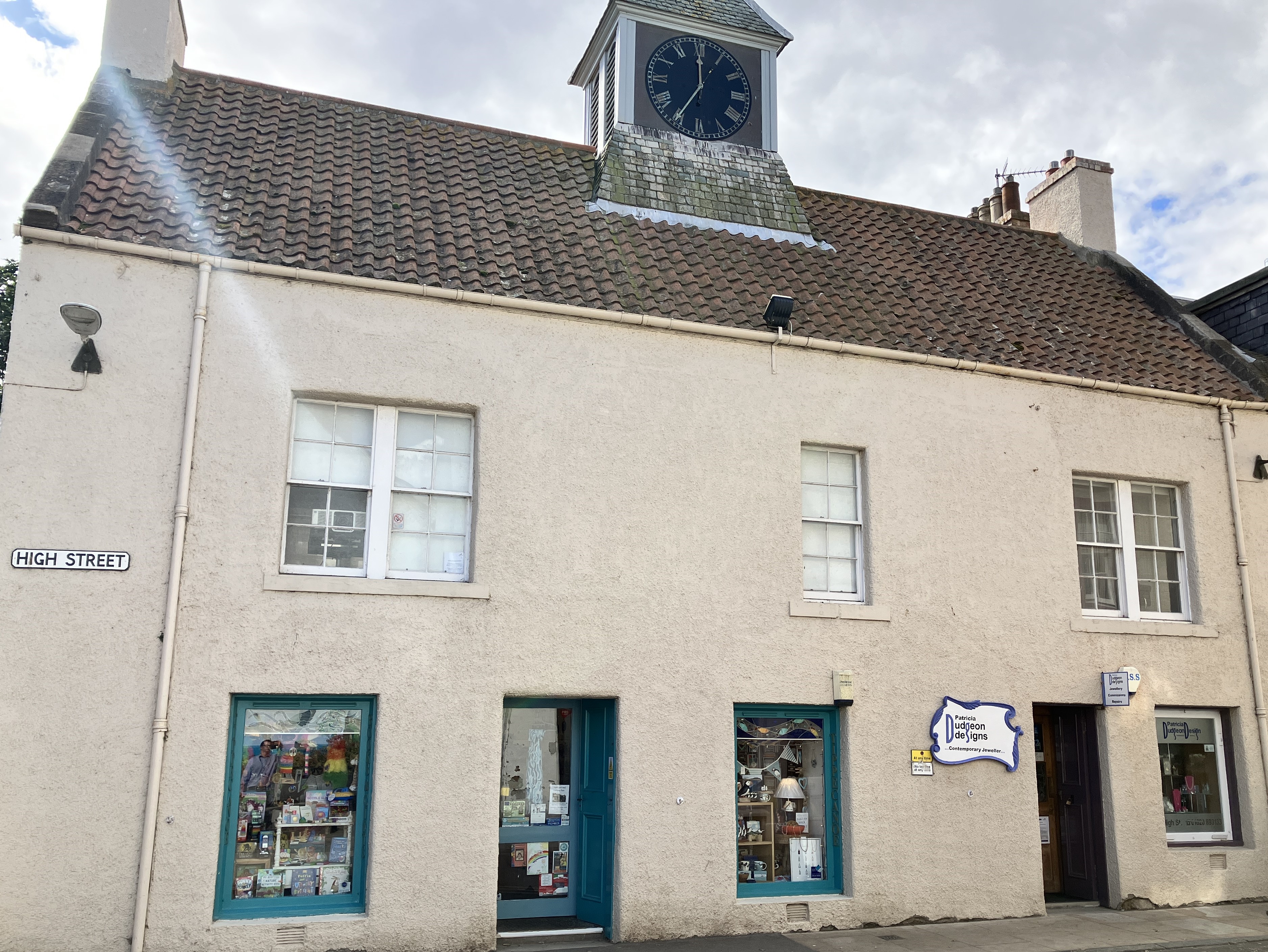 exterior of a historic building with a clock tower on the roof