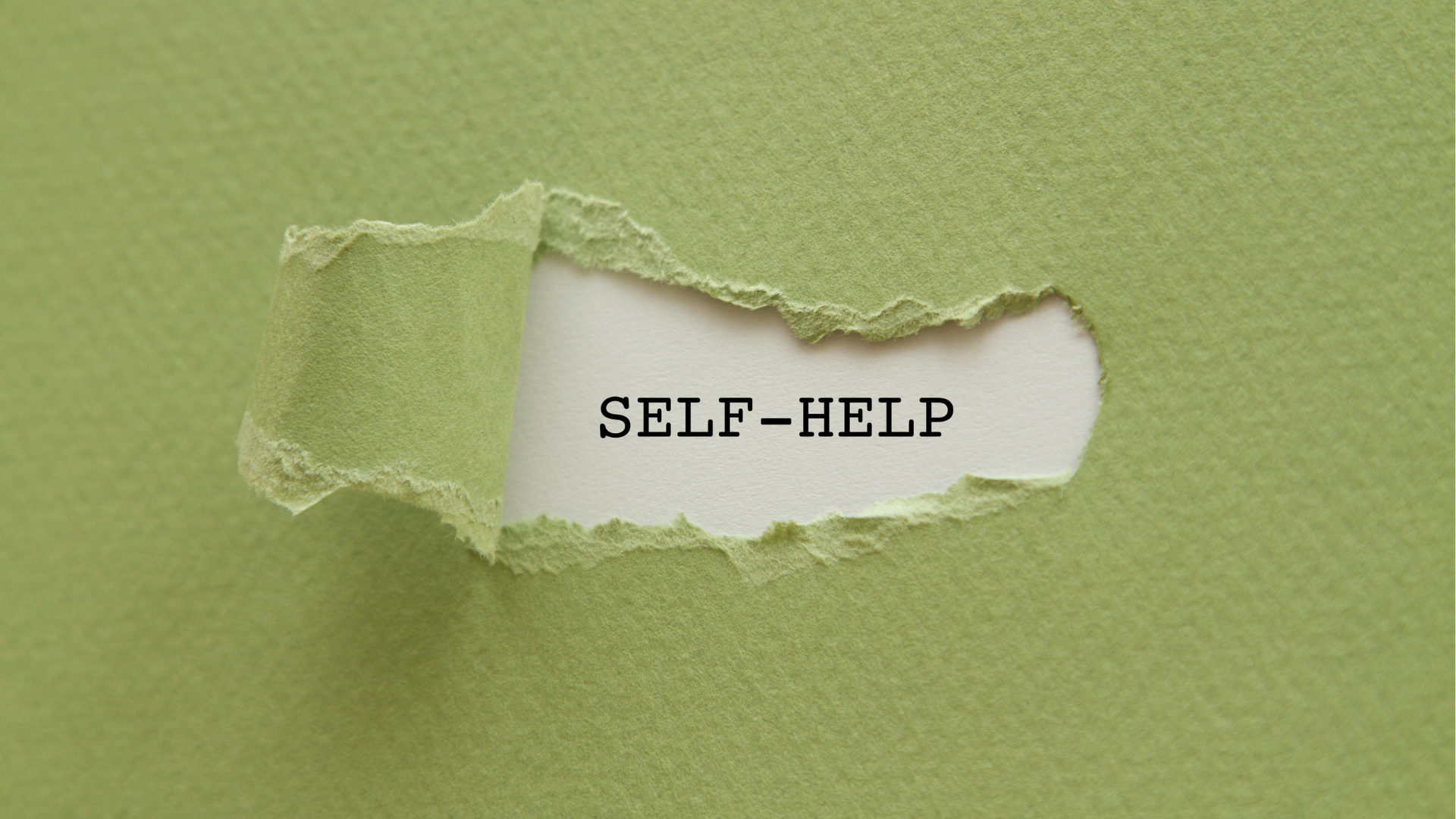 paper with strip torn back revealing self-help text