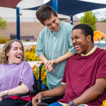 Teenagers laughing on wheelchairs
