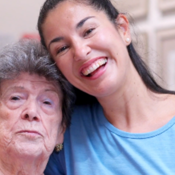 Carer taker and carer for person smiling