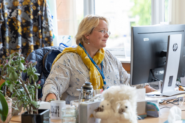 Woman working at computer screen