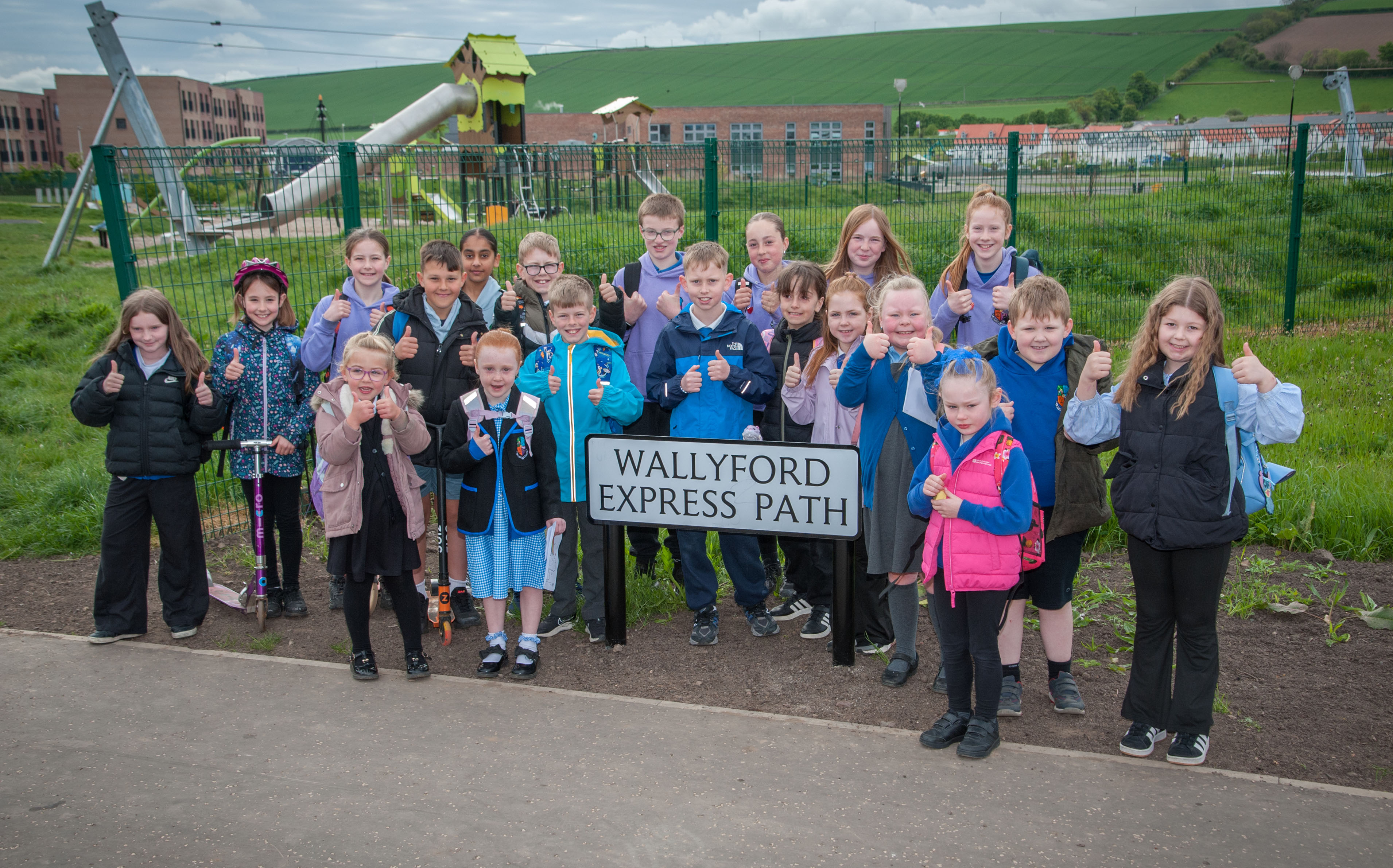 Photo showing children happy with their new route to school