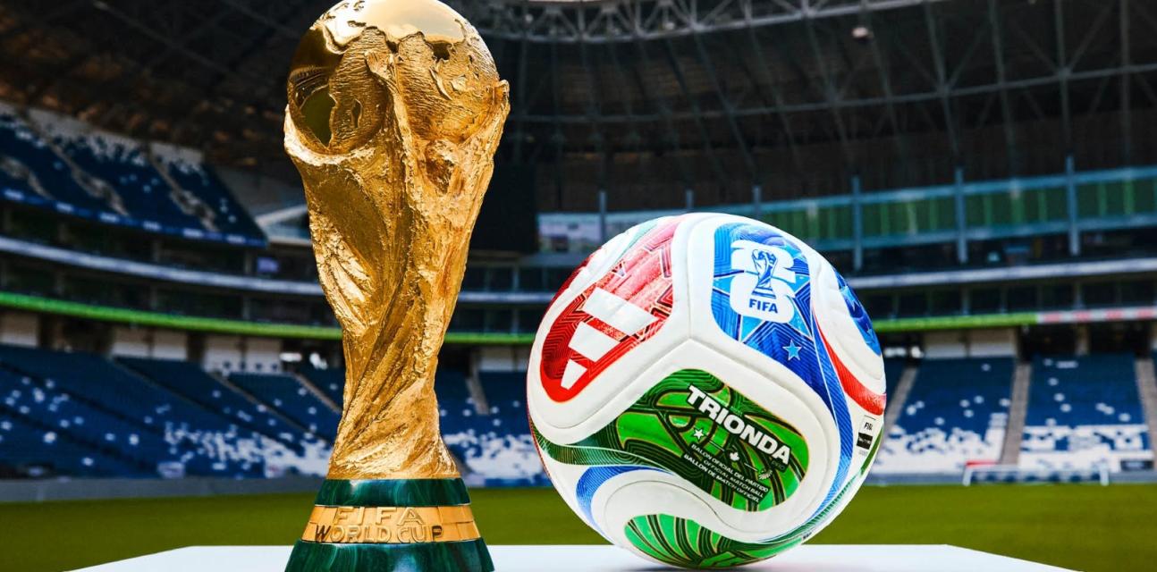 World cup trophy and football in stadium
