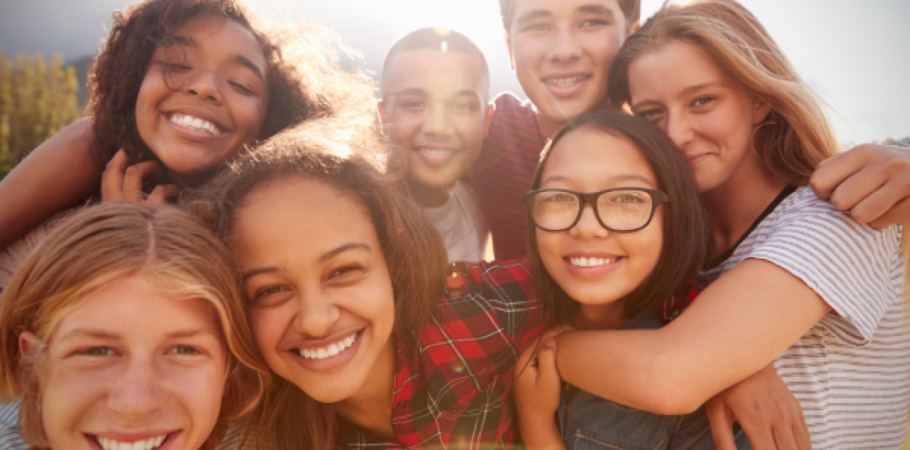 Seven young people taking a selfie