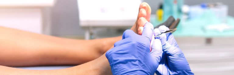 person having their feet examined by a podiatrist