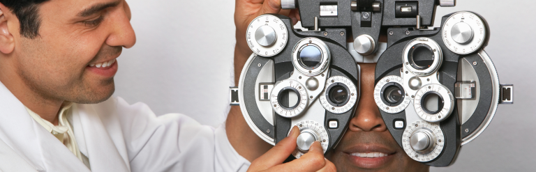 person having their eyes checked by an optician